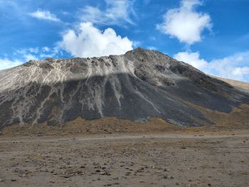 Scenic view of volcanic landscape against sky