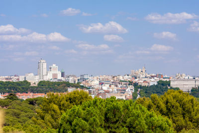 High angle view of buildings in city against sky