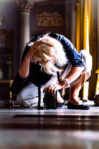 Midsection of woman shooting pictures