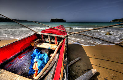 High angle view of boat moored on sea against sky