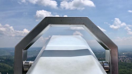 Low angle view of binoculars against sky