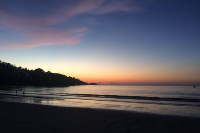 View of beach at sunset