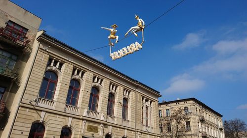 Low angle view of built structure against blue sky