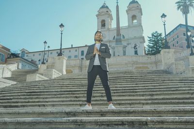 Low angle view of man walking on steps