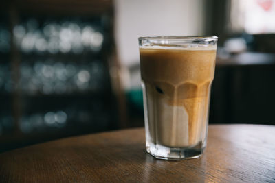 Close-up of coffee in glass on table