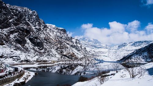 Scenic view of snowcapped mountains against sky