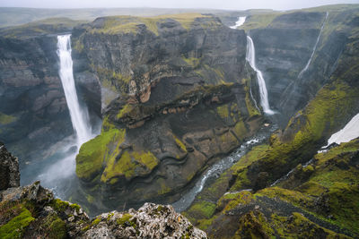 Haifoss, iceland's second-highest waterfall and granni waterfall in background and deep canyon.