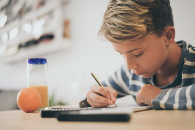 Boy studying at home