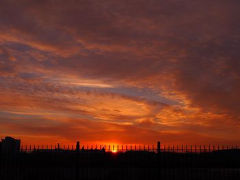 Scenic view of dramatic sky during sunset