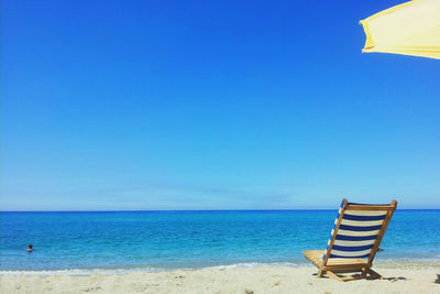 Deck chair at beach shore