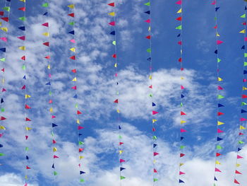 Colorful flags against sky