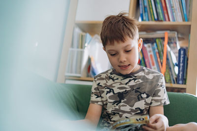 Portrait of boy playing with toy