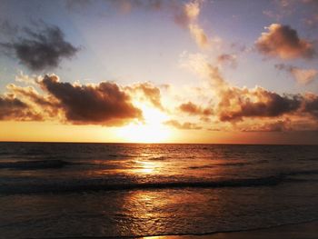 Scenic view of sea against cloudy sky