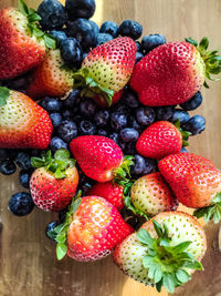 High angle view of strawberries on table