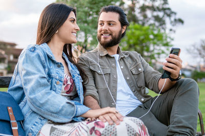 Friends using mobile phone