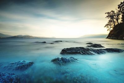 Scenic view of sea against sky at sunset