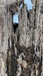 Low angle view of rock formation against sky