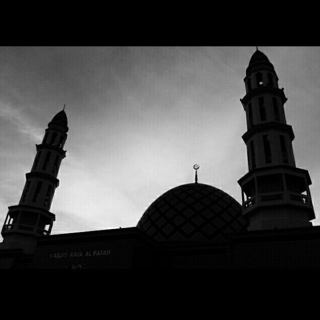 low angle view, architecture, built structure, building exterior, transfer print, sky, auto post production filter, place of worship, religion, church, tower, high section, spirituality, dome, cloud - sky, no people, outdoors, day, cloud