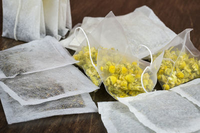 High angle view of flowers in bags on table