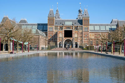 Buildings in city against clear sky