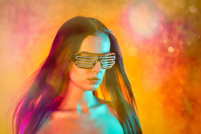 Portrait shot of a pretty young woman in rgb colors.