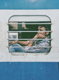 Man sleeping by window