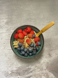 High angle view of strawberries in bowl on table