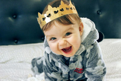 Portrait of cute baby boy wearing crown