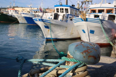 Fishing boats moored at harbor