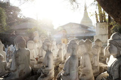 Statue against trees