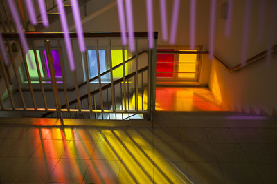 Multi colored lights on railing