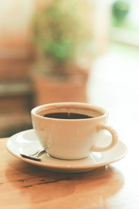 Close-up of coffee cup on table