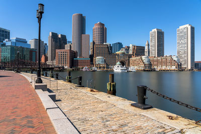 Modern buildings in city against clear sky