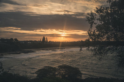 Scenic view of sunset over city