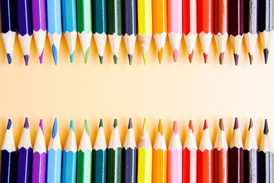 Close-up of colored pencils against white background