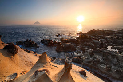 Scenic view of sea against sky during sunset