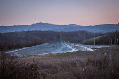 Scenic view of landscape against sky during sunset