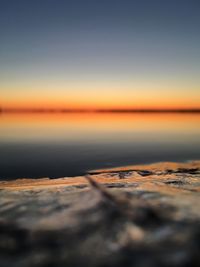 Surface level of sea against clear sky