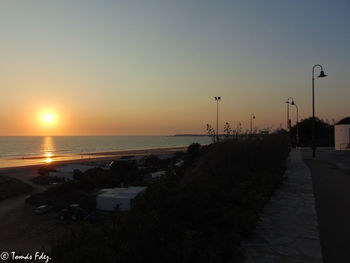 Scenic view of sea against clear sky during sunset