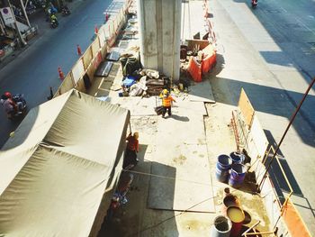 High angle view of people working on street in city