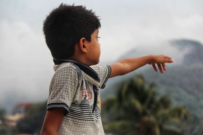 Side view of boy showing the beauty of nature