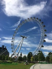 Low angle view of ferris wheel against sky