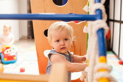 Cute boy playing with toy