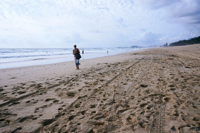Woman standing on beach