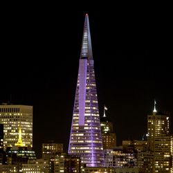 Low angle view of modern buildings at night