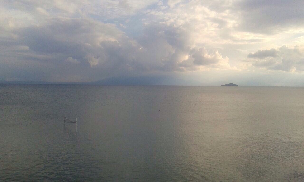 sea, water, sky, horizon over water, tranquil scene, tranquility, scenics, cloud - sky, beauty in nature, cloudy, nature, waterfront, cloud, idyllic, seascape, calm, rippled, outdoors, remote, no people