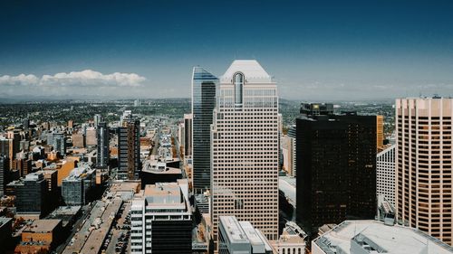 High angle view of buildings in city against sky