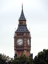 Low angle view of clock tower against sky