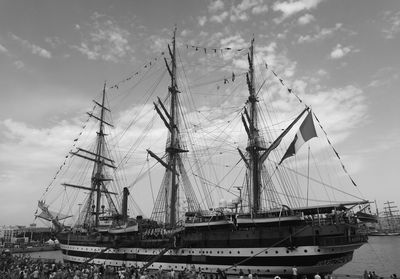 Harbor against cloudy sky