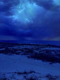 Scenic view of sea against sky at night